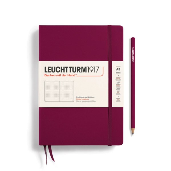 Port red hardcover dotted notebook with closure strap and two bookmarks.